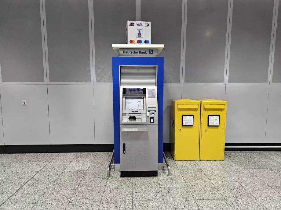 ATM Deutsche Bank, Aula Kedatangan, Terminal 1